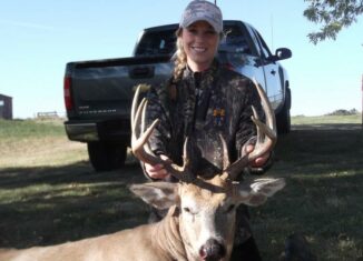 Woman archery whitetail photo